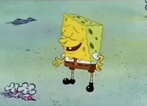 a cartoon of spongebob squarepants laughing in the sand .